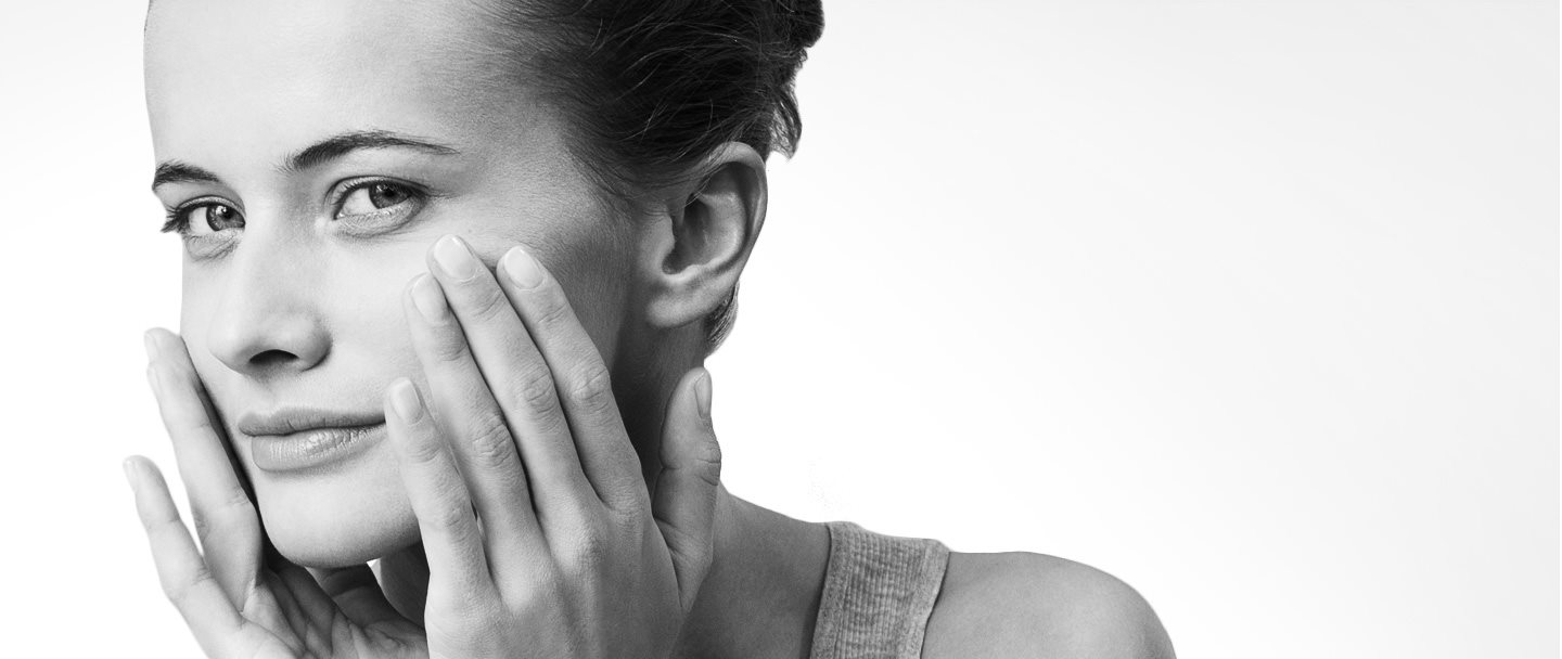 Woman with sensitive facial skin looking in the camera.